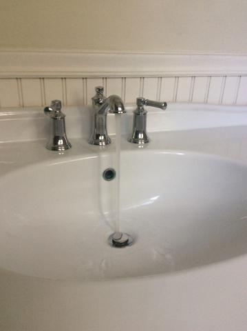 new faucet installed on bathroom sink